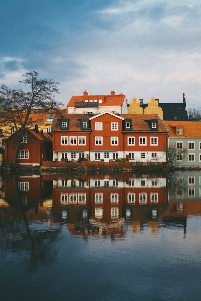 pexels photo 10391201 Colorful Scandinavian houses reflecting in the river in Uppsala, Sweden.